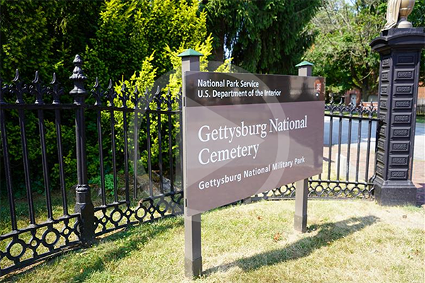 Gettysburg National Cemetery sign with video play button